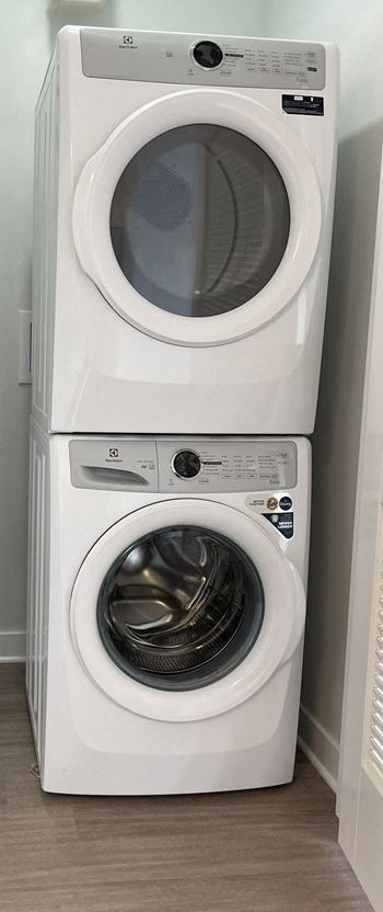 a washing machine and a dryer in a room